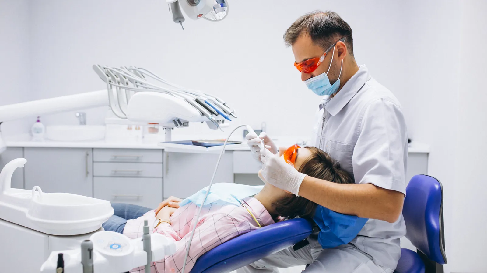Patient in dental chair during teeth extraction consultation