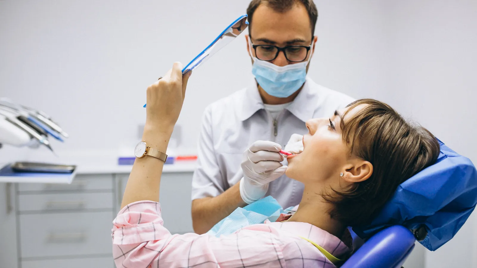 Patient in dental chair during teeth extraction consultation