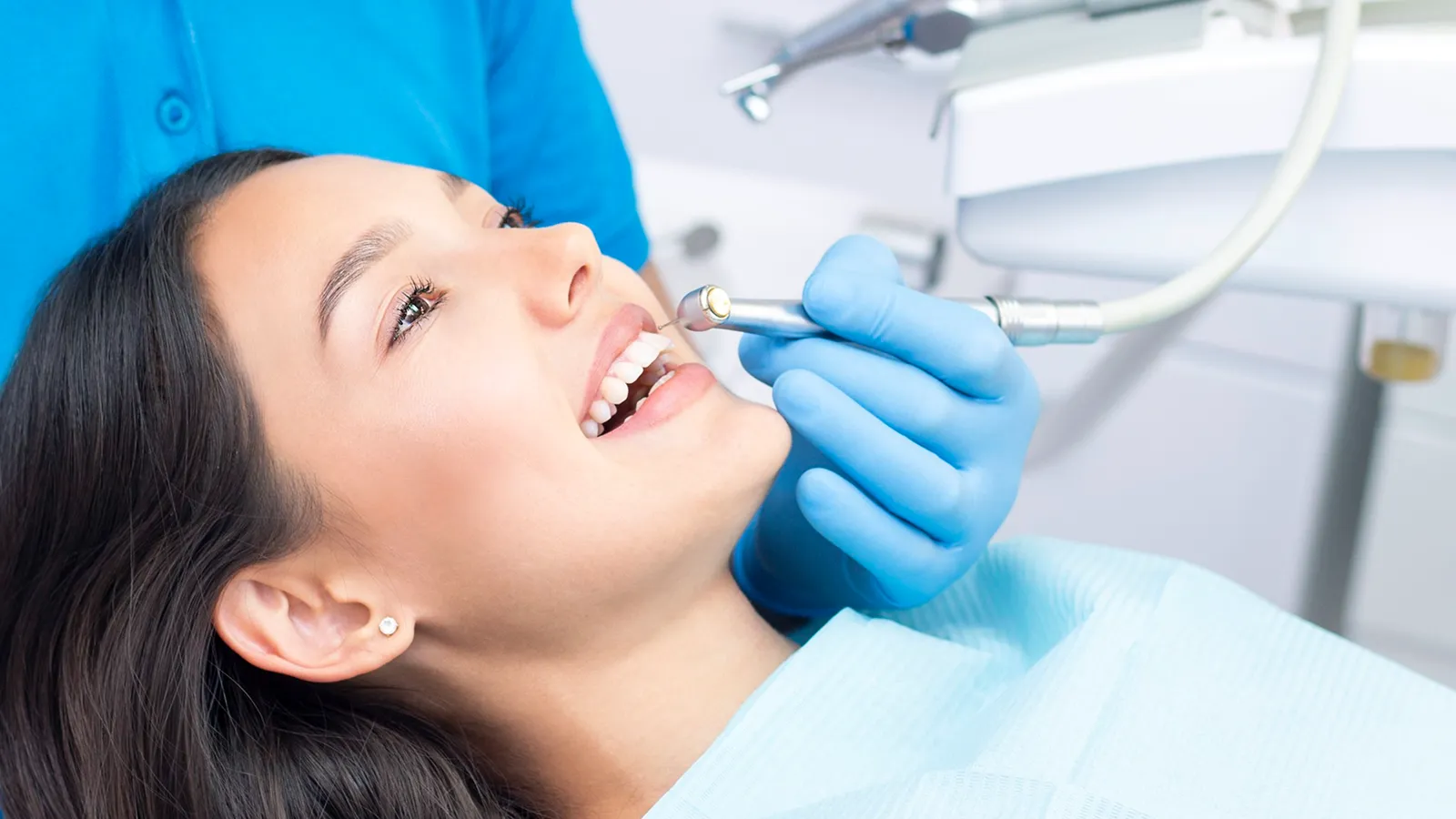 Patient in dental chair during teeth extraction consultation