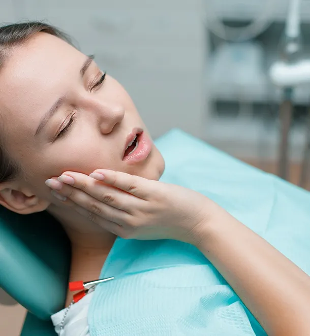 Patient smiling after same-day dental implant treatment