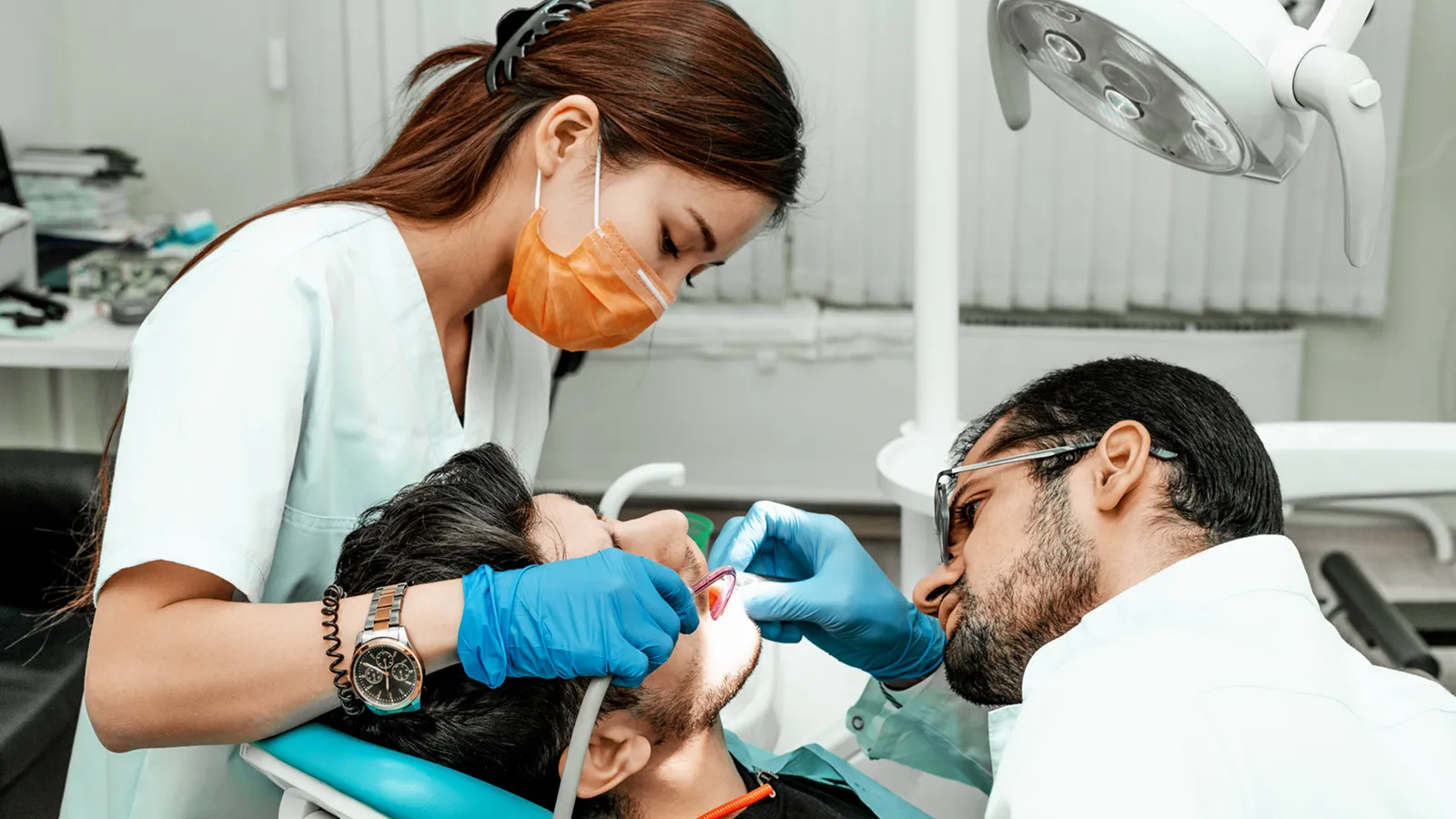 Patient in dental chair during teeth extraction consultation